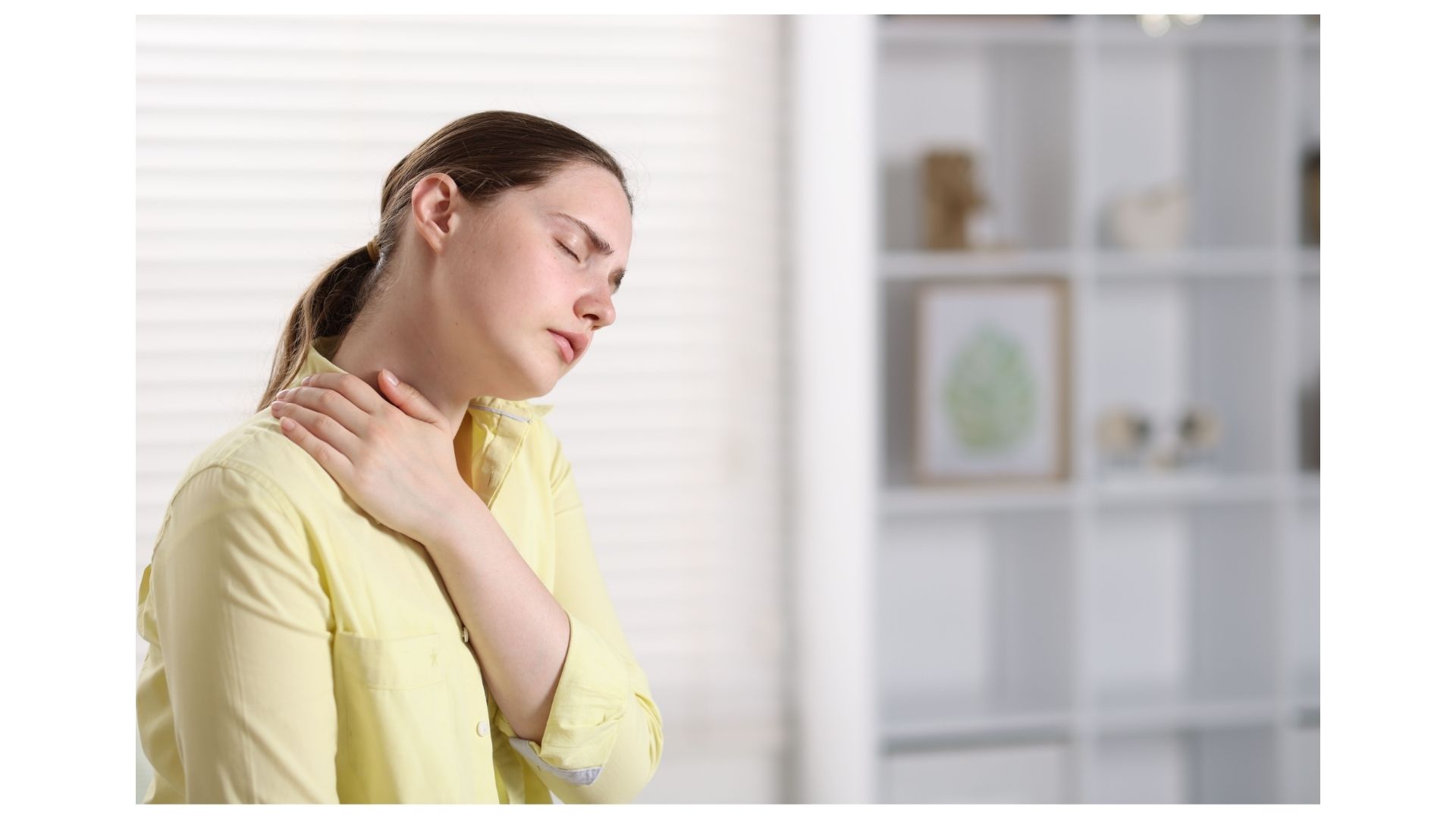 Woman in North Kansas City holding her neck and shoulder in discomfort from chronic neck pain and stiffness Woman in North Kansas City holding her neck and shoulder in discomfort from chronic neck pain and stiffness