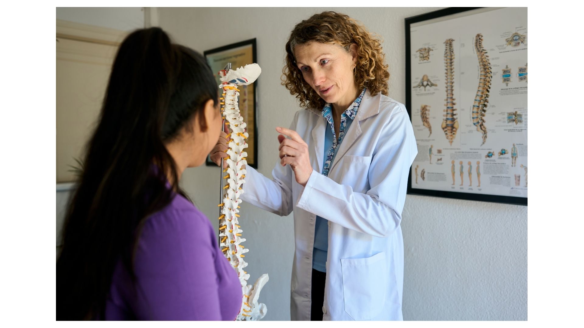 Dr. Birch explaining spinal anatomy with a spine model to a patient at Birch Chiropractic & Rehab in North Kansas City Dr. Birch explaining spinal anatomy with a spine model to a patient at Birch Chiropractic & Rehab in North Kansas City